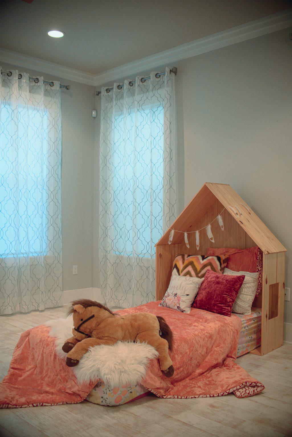 House-frame bed styled for a rental property shoot