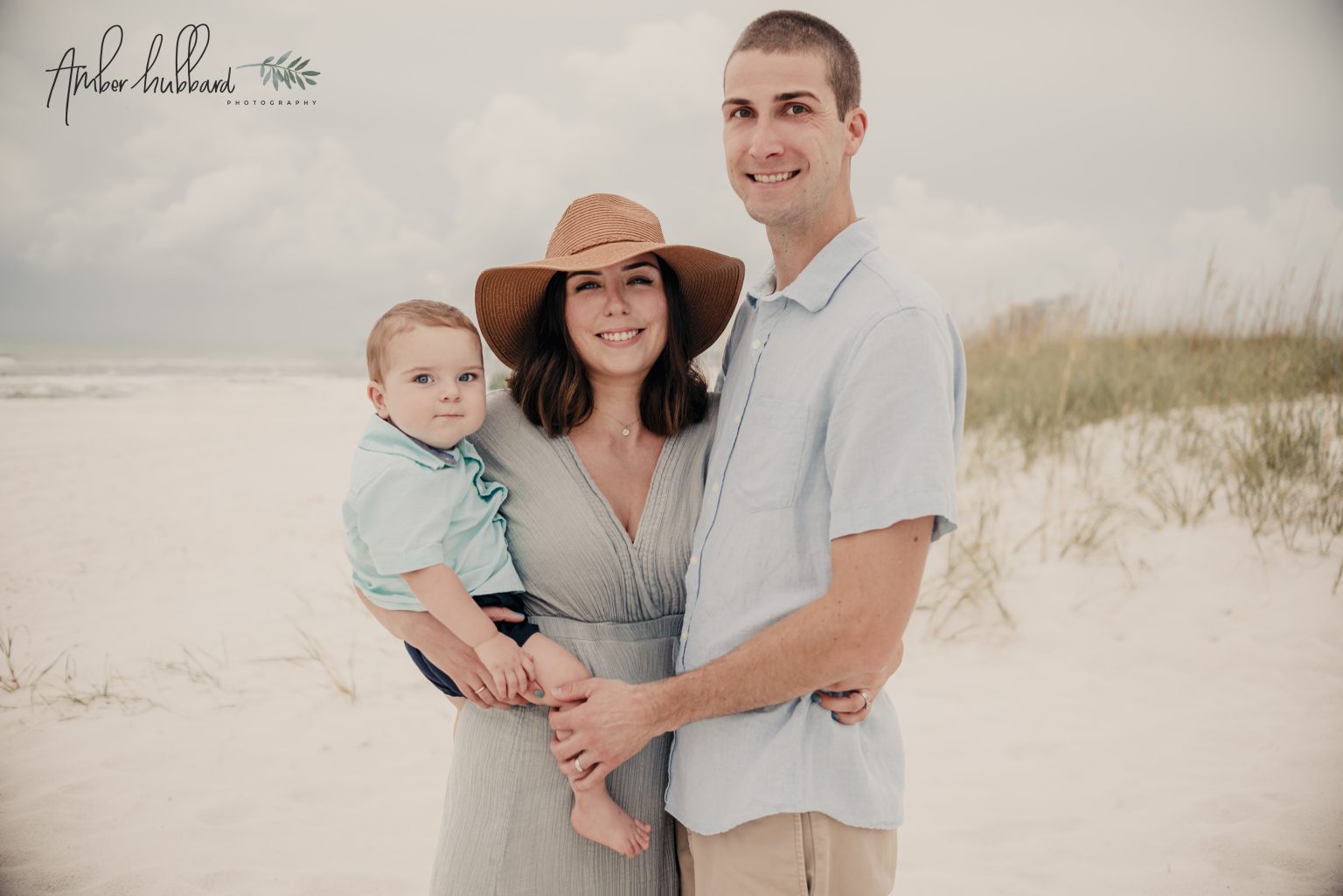 Young family of three on the beach