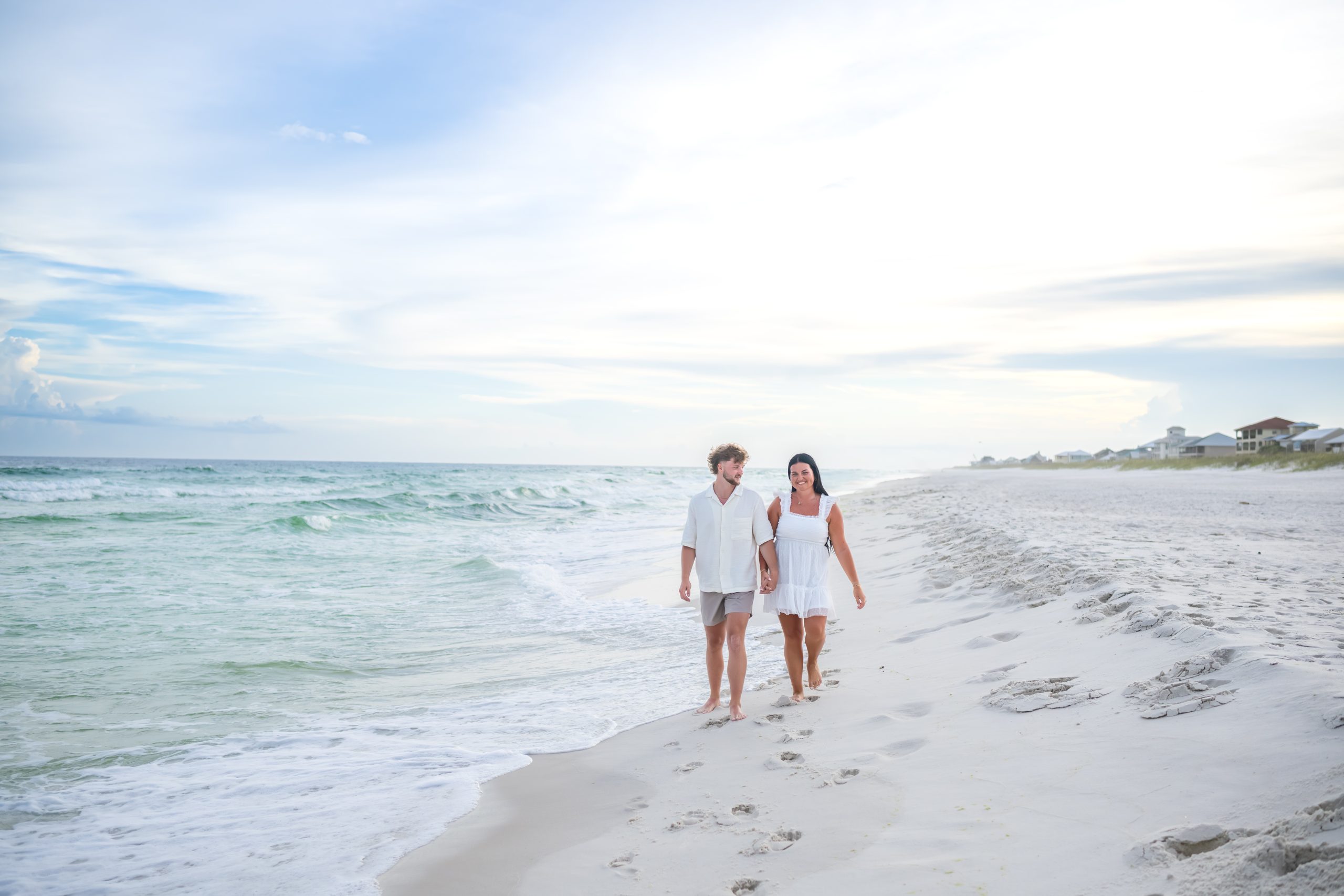 The wide open shoreline at Navarre Beach, Florida, looking toward the pier