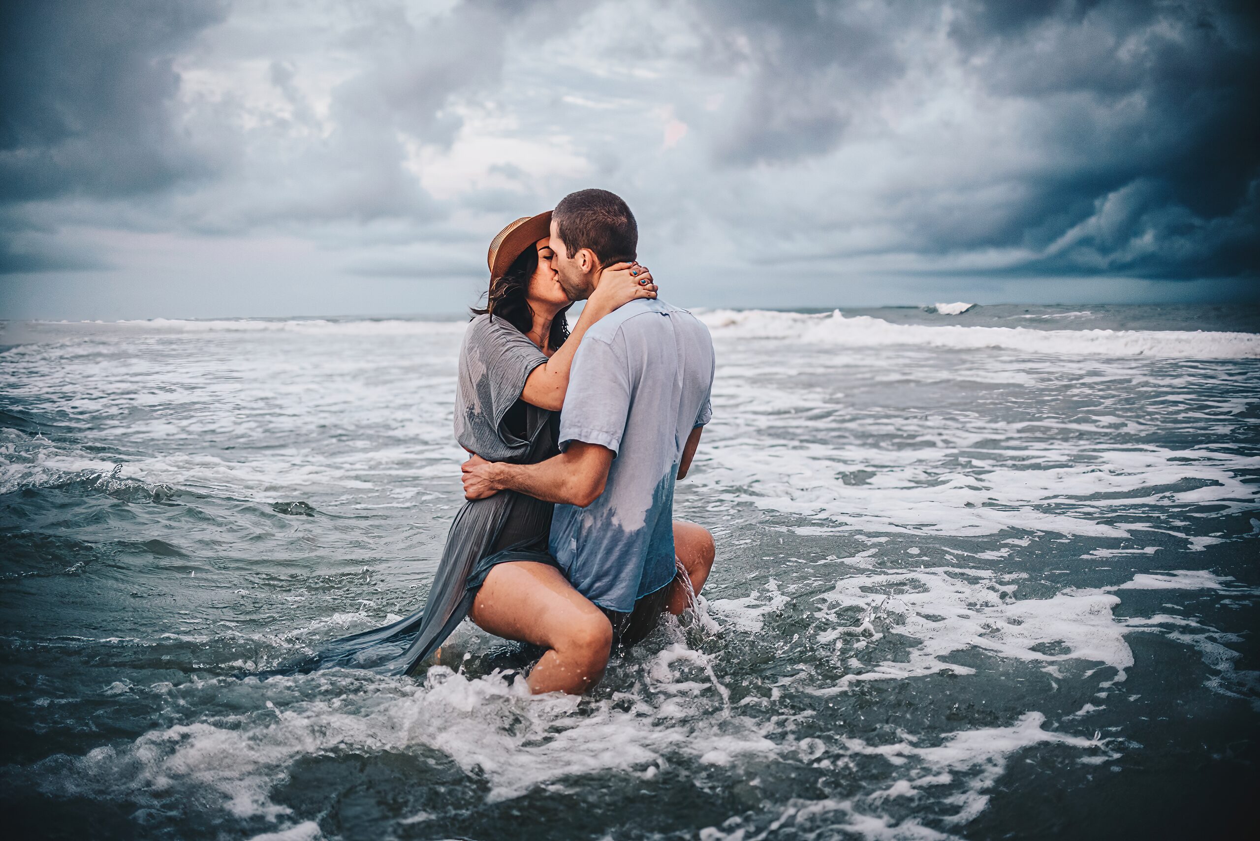 Navarre Beach couple in the water at golden hour