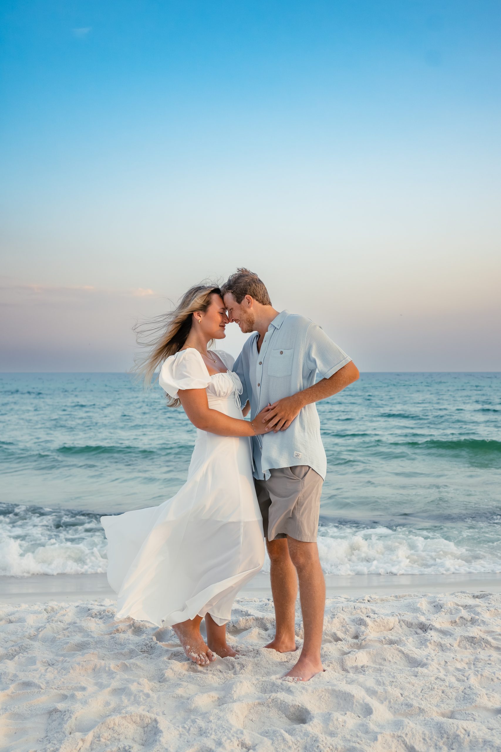 Couple embracing at sunset on Navarre Beach